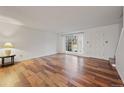 Bright living room with hardwood floors and a view of the backyard at 3855 S Monaco St # 176, Denver, CO 80237