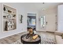 Stylish living room showcasing built-in shelving and a modern accent rug at 4868 Collingswood Dr, Highlands Ranch, CO 80130