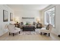 Bright and airy living room with neutral decor, bay window, and stylish furnishings at 6087 W 84Th Ave, Arvada, CO 80003