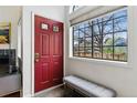 Bright entryway with a red front door, slate floors, and a large window offering great natural light at 3105 Galileo Ln, Boulder, CO 80301