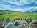 Expansive aerial view showcasing the home's location with mountain views and community surroundings at 5603 Van Bibber Ct, Golden, CO 80403