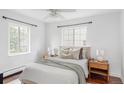Cozy bedroom featuring natural light, a comfortable bed and stylish nightstands at 2895 S Sherman St, Englewood, CO 80113
