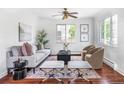 Bright living room featuring a comfortable sofa, stylish chairs, and a decorative rug at 2895 S Sherman St, Englewood, CO 80113