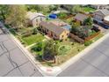 Aerial view of the property showcasing the landscaped yard, neighboring houses and street at 998 S Leyden St, Denver, CO 80224