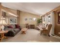 Spacious living room with vaulted ceilings and ample natural light at 1429 S Grand Baker Cir, Aurora, CO 80018