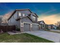 Well-maintained home with attached three-car garage, manicured lawn and landscaping, in a friendly neighborhood at 1831 Ashford Cir, Longmont, CO 80504