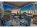 Inviting covered porch with comfortable seating, perfect for relaxing and enjoying neighborhood views at 1831 Ashford Cir, Longmont, CO 80504