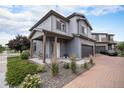 Attractive two-story home with an attached garage, covered front porch and beautiful landscaping at 17996 E 54Th Ave, Denver, CO 80249
