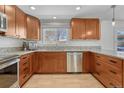 Well-lit kitchen showcasing stainless steel appliances and beautiful granite countertops at 5080 S Boston St, Greenwood Village, CO 80111