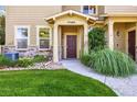 Inviting front entryway with beautiful landscaping and exterior stone accents at 10480 Truckee St # B, Commerce City, CO 80022