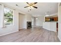 Spacious living room with fireplace and large window offering natural light at 10480 Truckee St # B, Commerce City, CO 80022