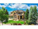 Charming two-story house boasts professional landscaping, a three-car garage, and stone accents at 1647 Harris Ct, Erie, CO 80516