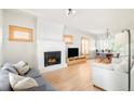 Inviting living room with a fireplace, hardwood floors, and an open layout with natural light at 277 S Gilpin St, Denver, CO 80209