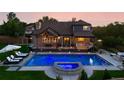 Stunning backyard with a pool, hot tub, and outdoor seating area, perfect for entertaining at 3749 White Bay Dr, Highlands Ranch, CO 80126