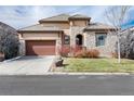 Charming single Gathering house featuring stone accents, manicured landscaping, and a welcoming front entrance at 16 Willowcroft Dr, Littleton, CO 80123