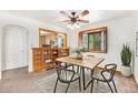 Cozy dining room with natural light, wood accents, and modern furnishings at 3790 W 54Th Ave, Denver, CO 80221