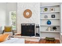 A charming white stone fireplace features built-in shelving at 2645 S Xanadu Way # C, Aurora, CO 80014