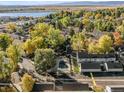 An aerial view highlights townhome living, a landscaped common area, and mature trees at 5374 W Canyon Trl # B, Littleton, CO 80128