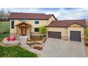 Stunning two-story home with a stone facade, well-maintained landscaping, and a three-car garage, offering curb appeal and convenience at 3048 Starling Ct, Castle Rock, CO 80109