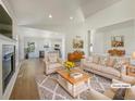 Bright, airy living room with hardwood floors, neutral colors, and stylish furniture at 11933 W 83Rd Ln, Arvada, CO 80005