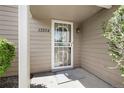 Close-up of the front door with security screen and visible house number at 13254 E Asbury Dr, Aurora, CO 80014
