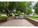 Inviting outdoor patio area with comfortable seating, perfect for relaxation and enjoying the surrounding view at 4 Doral Ln, Littleton, CO 80123