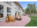 Relax on the patio with a cozy fire pit and beautiful mountain views at 1425 Autumnwood Ln, Evergreen, CO 80439