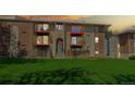 Exterior full view of multi-level residential home with brick, stone, and private balconies at 12120 Melody Dr # 308, Westminster, CO 80234