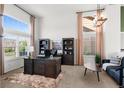 Bright office space with large windows, high ceilings, and elegant furnishings at 8864 S Field Ct, Littleton, CO 80128