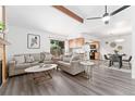 Open-concept living area boasts hardwood floors, vaulted ceilings, and a cozy fireplace at 10836 W Evans Ave # 29, Lakewood, CO 80227