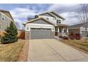 Beautiful home with a two-car garage and well-maintained front lawn and long driveway at 2033 E 167Th Way, Thornton, CO 80602