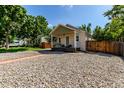 Charming home with stone landscaping, a well-maintained yard, and a welcoming exterior at 4450 S Fox St, Englewood, CO 80110