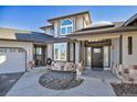 Front entrance with stone accents and a covered porch at 16521 E Easter Way, Foxfield, CO 80016