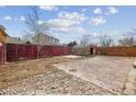 Large backyard featuring a shed, a patio, and mature trees, great for entertaining at 15614 E 51St Pl, Denver, CO 80239