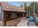 A beautiful stone patio with ample seating and lighting, perfect for outdoor enjoyment at 11724 Little Turtle Ln, Conifer, CO 80433