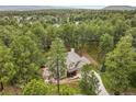 Secluded home nestled amongst dense trees providing both privacy and amazing views of the surrounding natural beauty at 10 Long Bow Cir, Monument, CO 80132