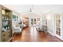 Bright living room with high ceilings, hardwood floors and French doors at 7970 S Cook Way, Centennial, CO 80122