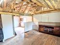 Spacious room with original hardwood floors and exposed beams for a rustic feel at 6608 Hooker St, Denver, CO 80221