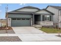 Charming single Gathering home with a two-car garage and stone accents at daytime at 24088 E Atlantic Pl, Aurora, CO 80018