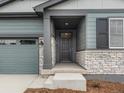 This home boasts a covered front porch, perfect for enjoying the outdoors and relaxing at 24088 E Atlantic Pl, Aurora, CO 80018