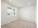 Bright bedroom featuring neutral carpet, a window with blinds, and recessed lighting at 17305 E 91St Pl, Commerce City, CO 80022