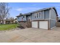 Charming two-story home with a well-manicured lawn, brick accents, and a two-car garage at 6893 S High St, Centennial, CO 80122