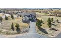 Aerial view of a beautiful home situated on a large lot with a long driveway at 5285 La Quinta Cir, Elizabeth, CO 80107