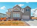 Charming two-story home with a two-car garage and well-maintained lawn at 6361 Kenzie Cir, Castle Pines, CO 80108