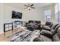 Relaxing living room featuring hardwood floors and comfortable seating at 2300 Mountain Sky Dr, Fort Lupton, CO 80621