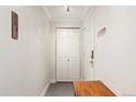 Hallway with grey tile, closet, and security system at 1350 Josephine St # 307, Denver, CO 80206