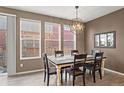 Well-lit dining area with modern chandelier and ample space for entertaining at 11440 E 26Th Ave, Aurora, CO 80010