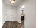 Bright hallway with wood floors, leading to the kitchen at 1011 Pierce St # 11, Lakewood, CO 80214