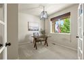 Bright office space with natural light, a wooden desk, and a comfortable chair, perfect for remote work at 2815 Dreamcatcher Loop, Castle Rock, CO 80109
