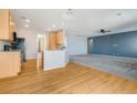 Spacious eat-in kitchen offering hardwood floors, great layout, and flow to living area at 275 Gold Maple St, Brighton, CO 80601